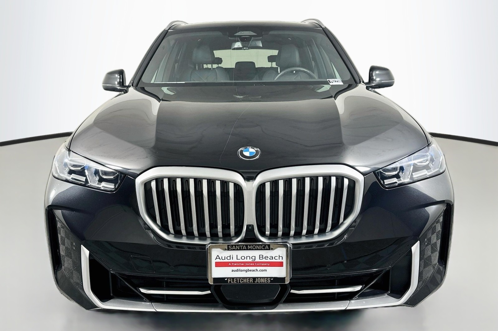 Used 2025 Black Sapphire Metallic BMW sDrive40i image 2