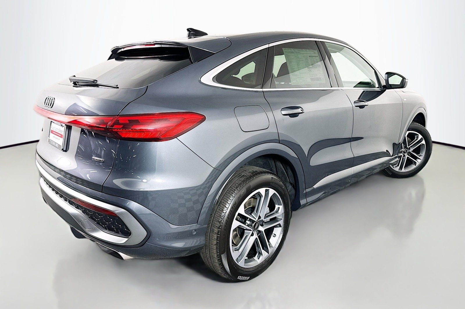 New 2026 Tambora Gray Metallic Audi Premium Plus image 13