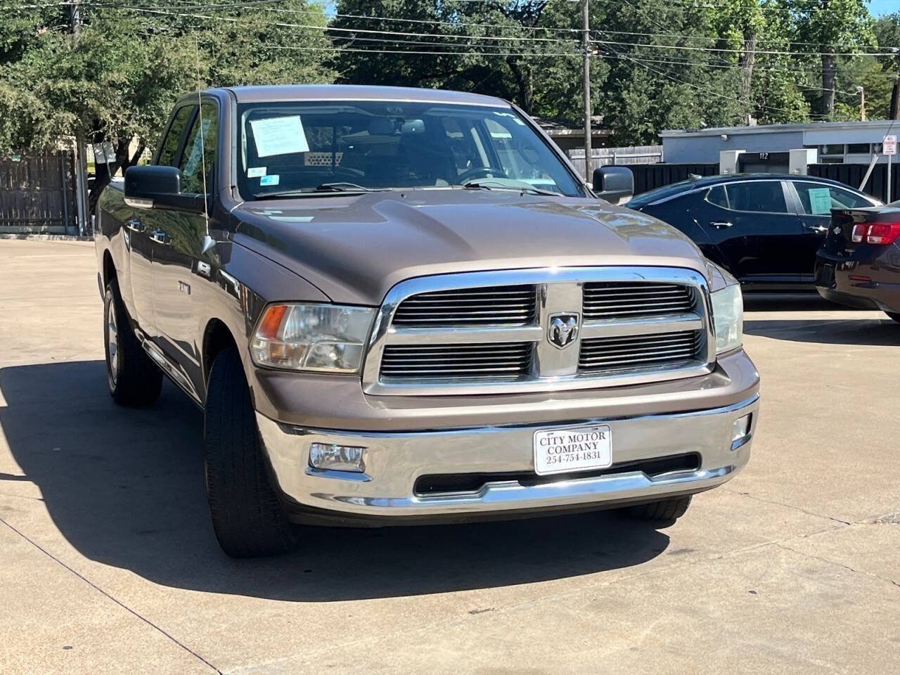 Brown (Austin Tan Pearlcoat) 2010 Dodge RAM 1500 Pickup Truck 4X2 Automatic