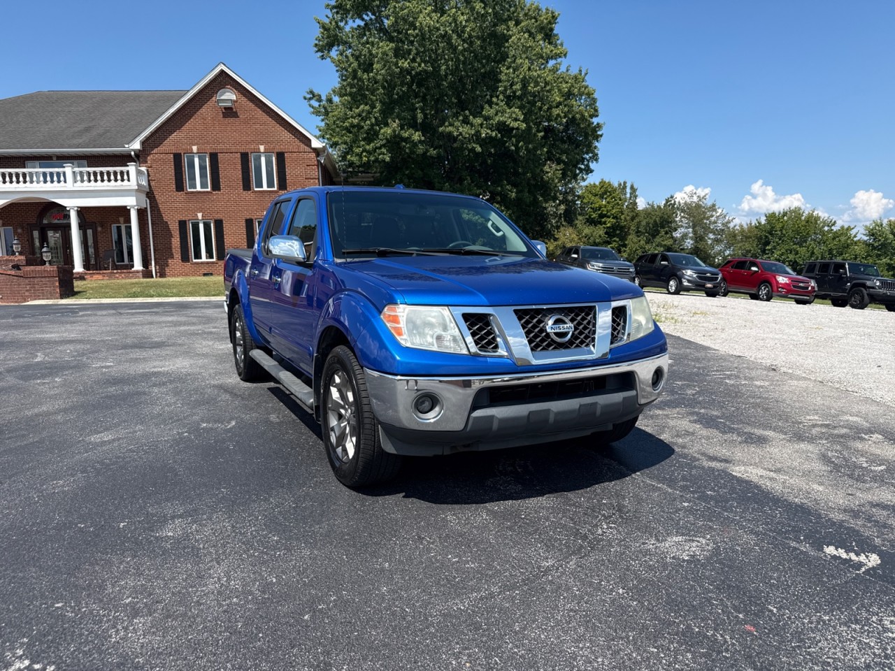 Metallic Blue 2014 Nissan Frontier Pickup Truck Four-Wheel Drive Automatic